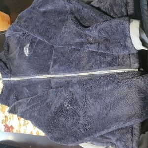 Woman's zip up coat.